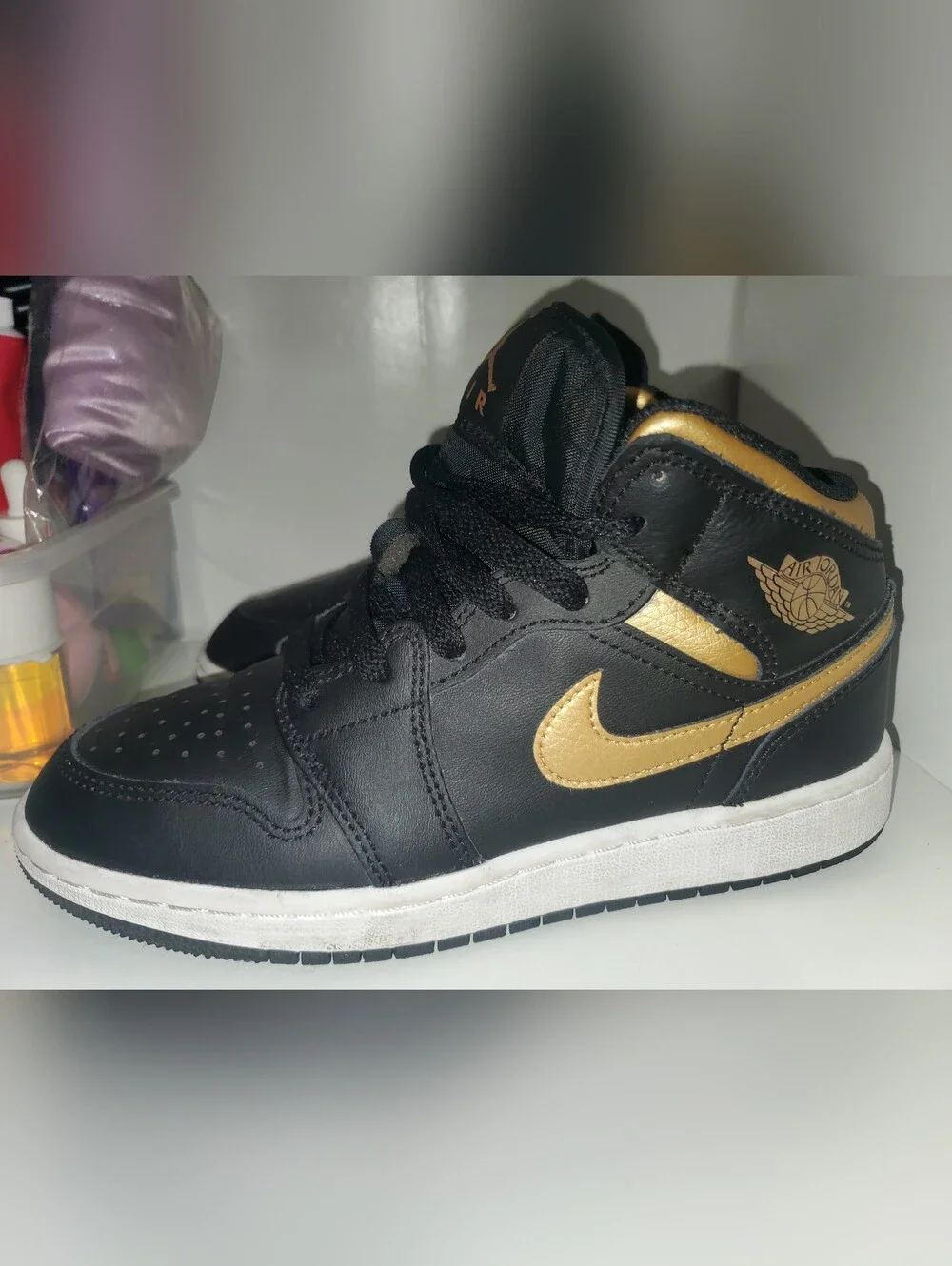 Nike Air Jordan 1 Mid Black/Gold Low-Top Sneakers